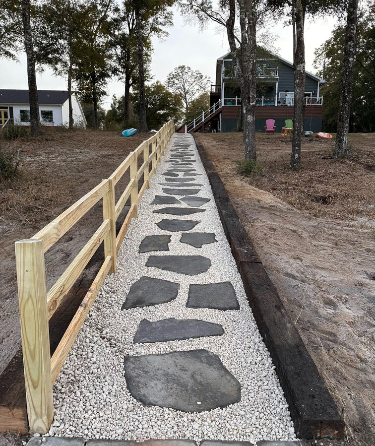 Flagstone stair treads, steppers, gravel, and handrail