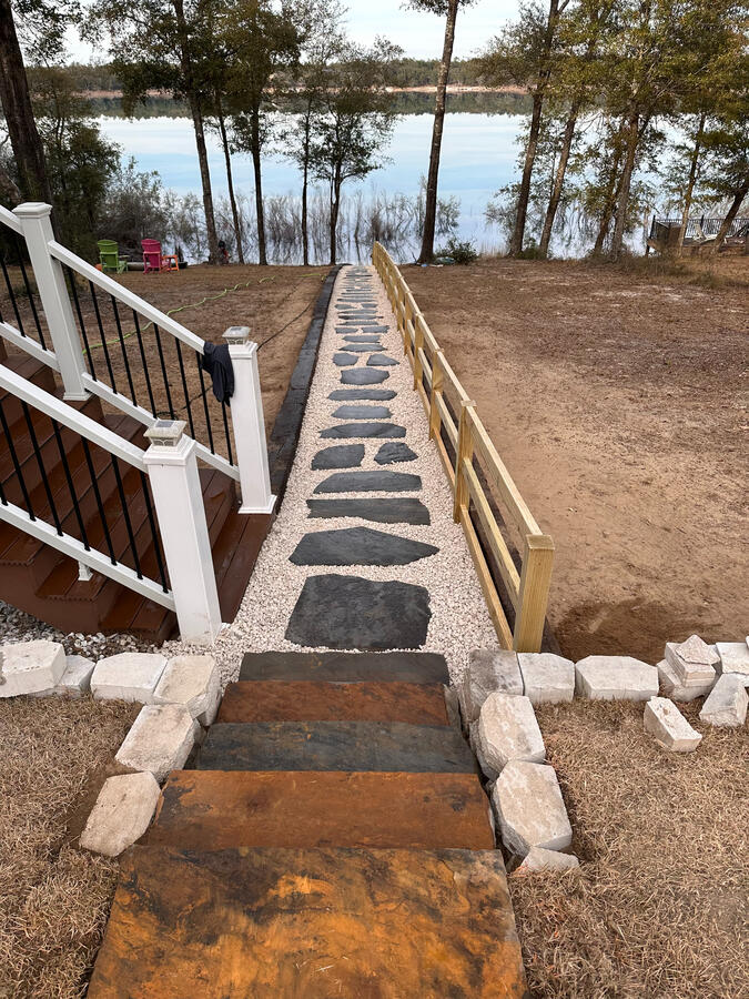 Flagstone stair treads, steppers, gravel, and handrail