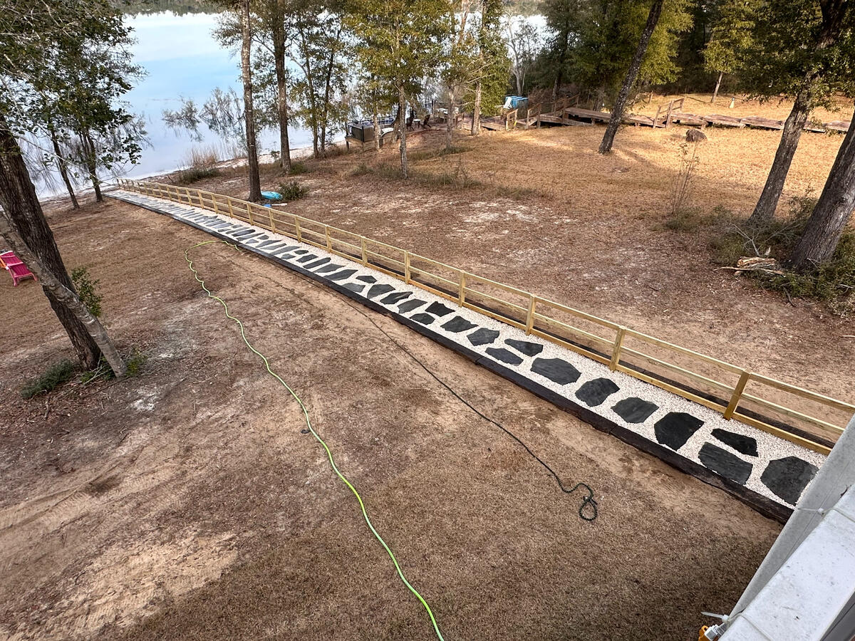 Flagstone stair treads, steppers, gravel, and handrail