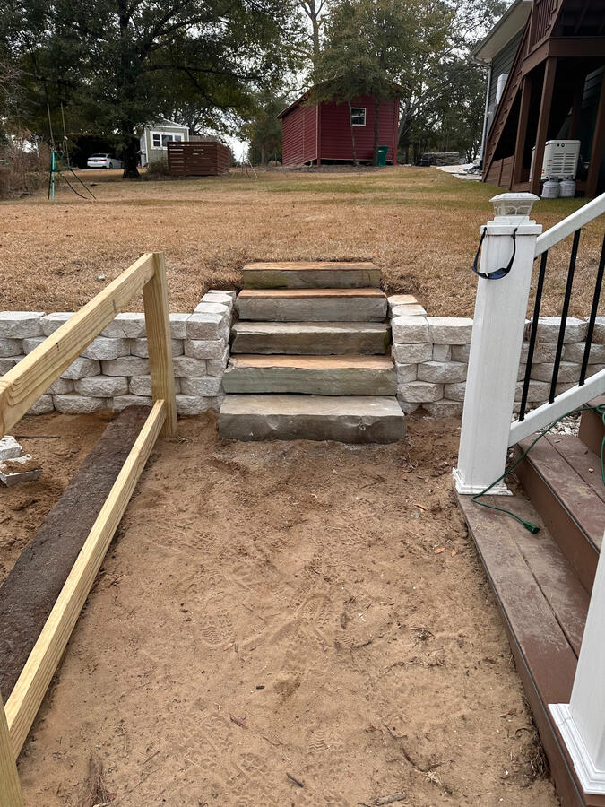 Flagstone stair treads, steppers, gravel, and handrail