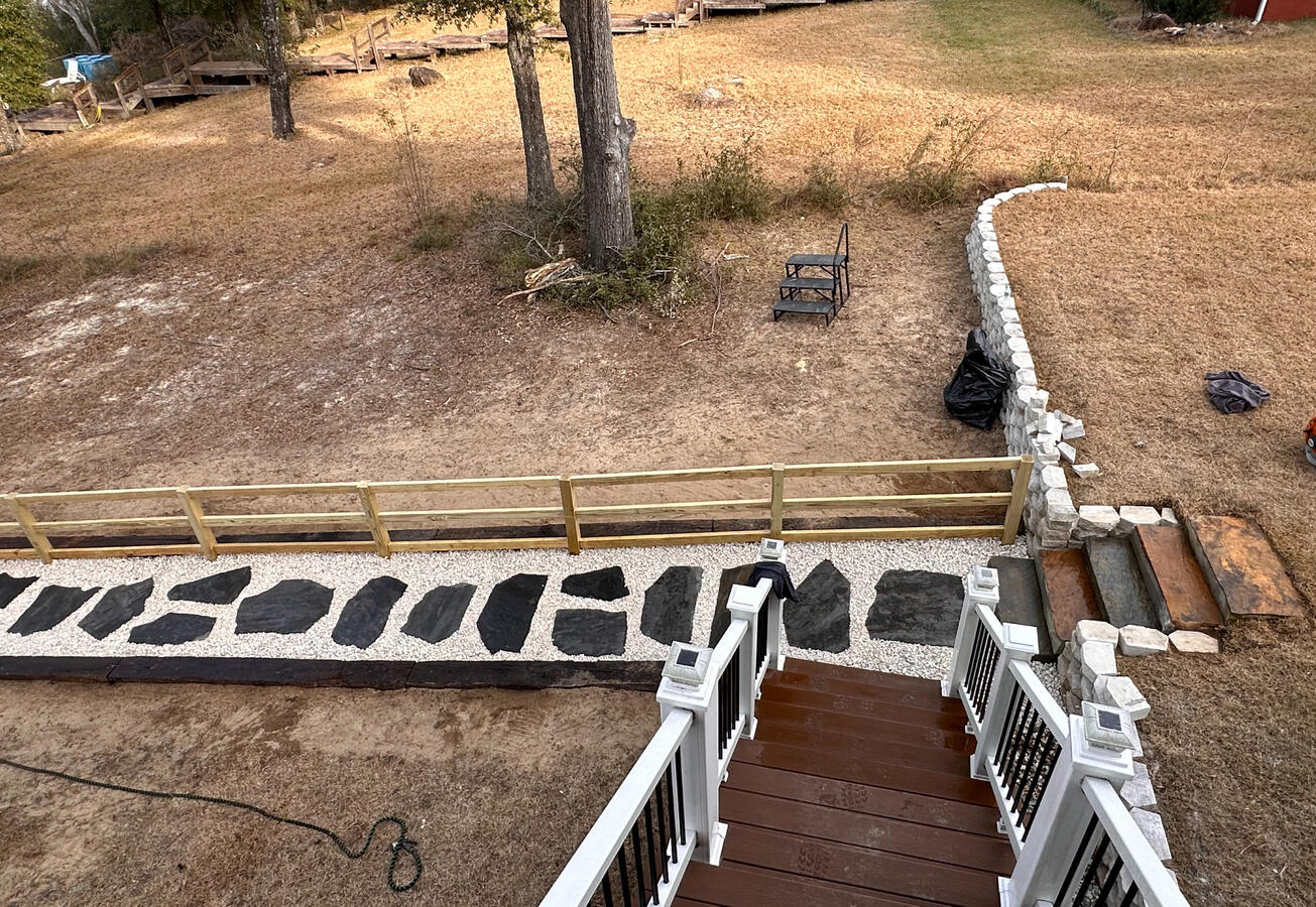 Flagstone stair treads, steppers, gravel, and handrail